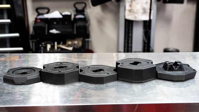 All the inner weight plates spread out on the table.