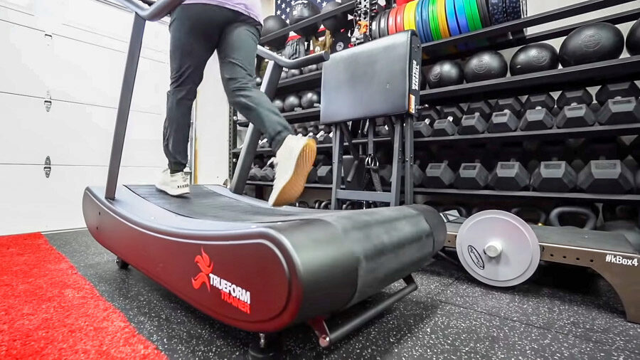 Side view of Coop running on TrueForm Trainer