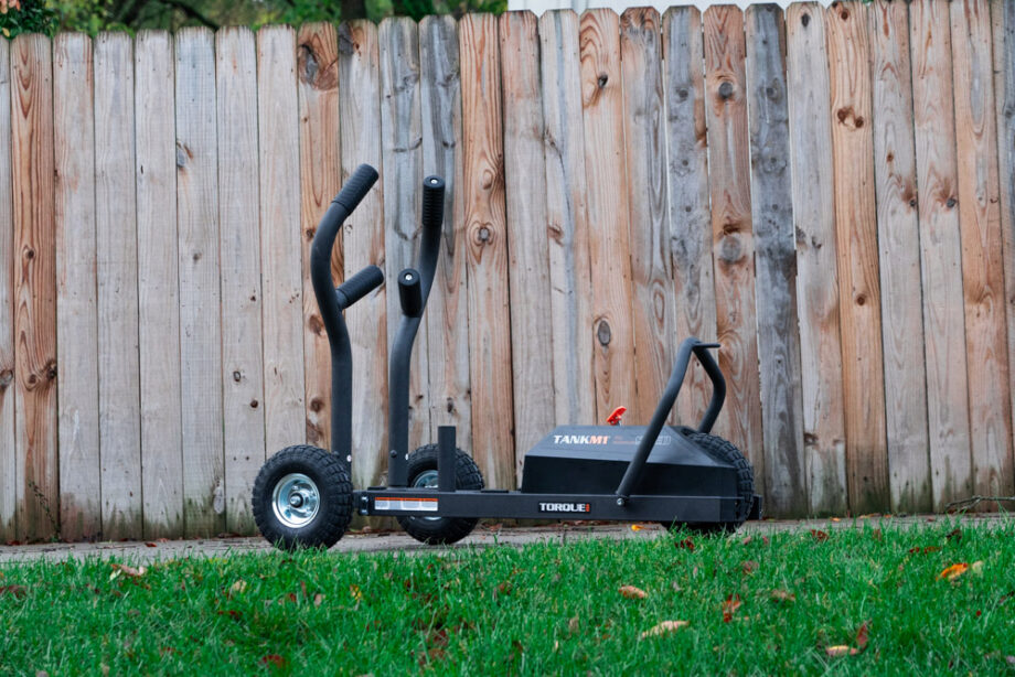 The TANK M1 Sled against the background of a fence.