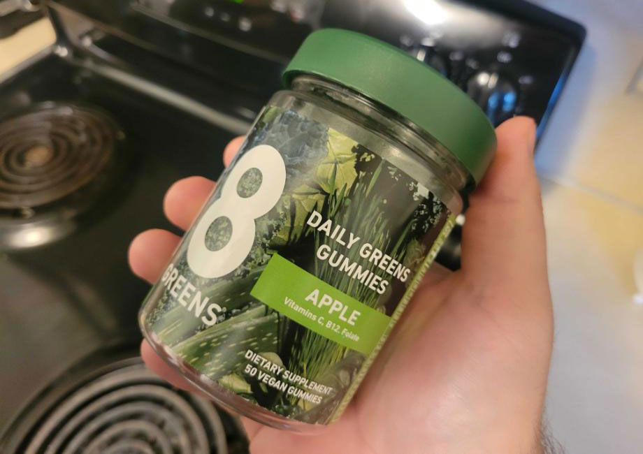 A bottle of apple-flavored 8Greens Gummies.