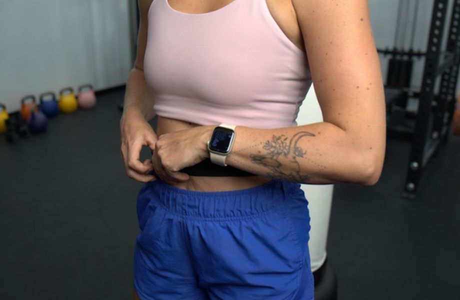 Woman wearing Apple Watch in a gym