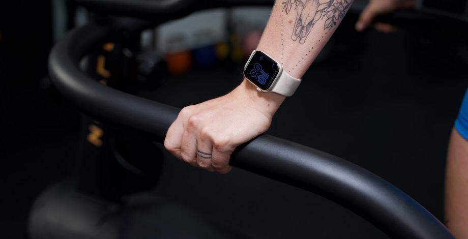 A person works on while wearing an Apple Watch