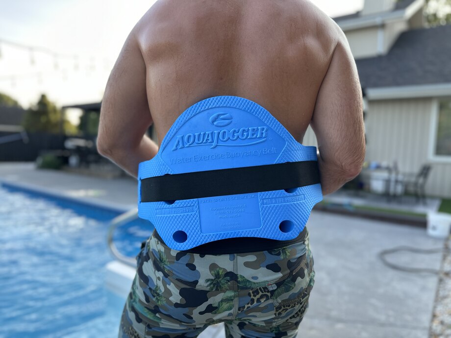 Our tester climbs out of the pool long enough to show off the AquaJogger Belt