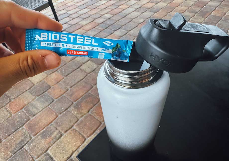 Our tester holds a packet of BioSteel Hydration Mix