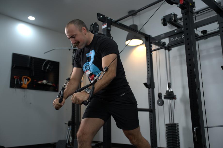 Man doing chest flyes using the Body-Solid Functional Trainer Rack