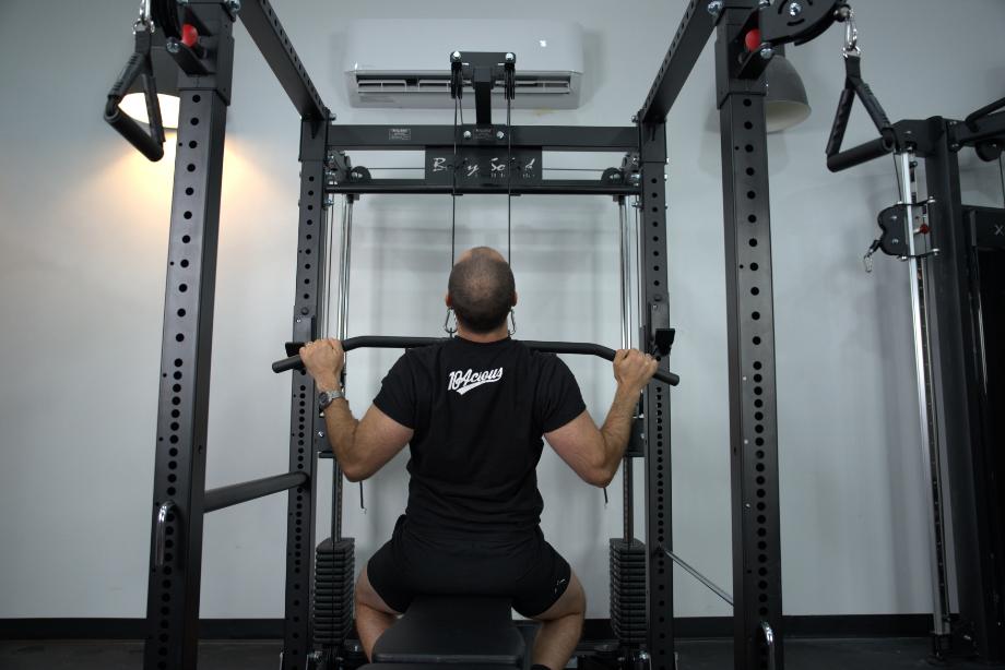 Man performing lat pulldowns for the Body-Solid Functional Trainer Rack review