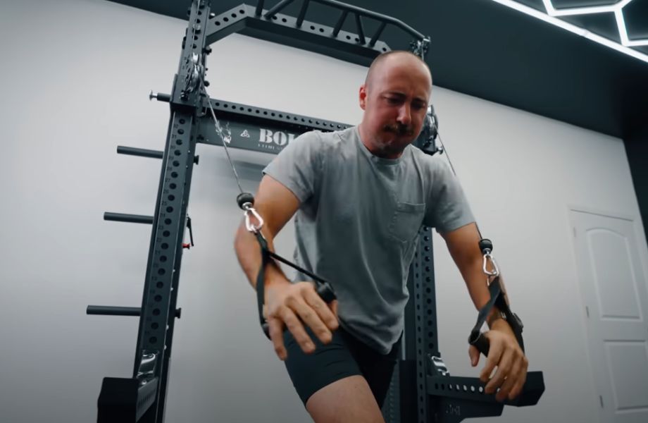 Man performing cable chest fly on Bolt Warlord functional trainer