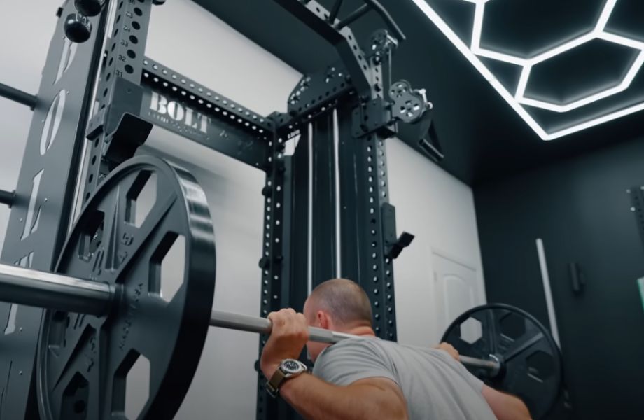 Man squatting in the Bolt Warlord half rack