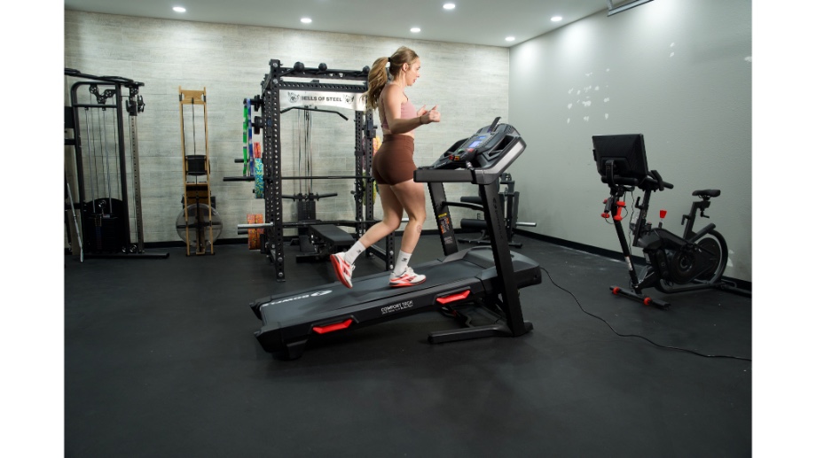 Woman running at an incline on Bowflex BXT8J treadmill