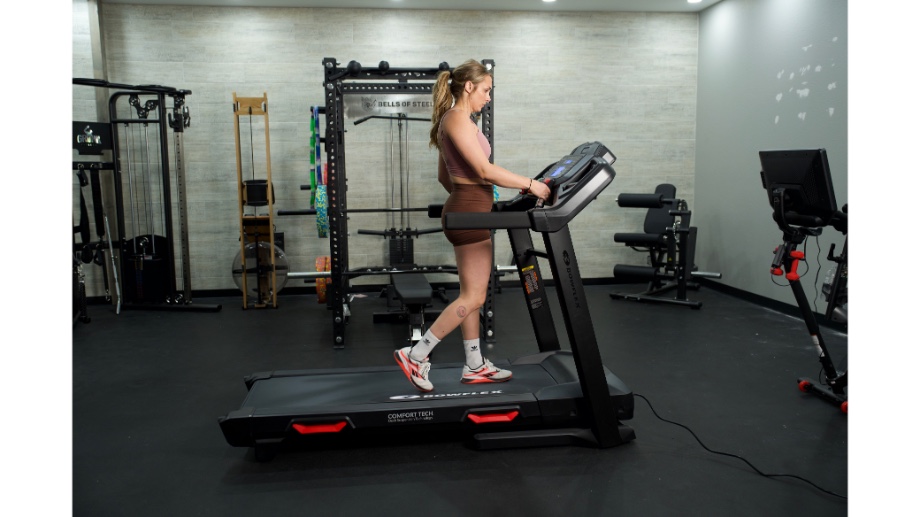 Woman walking on Bowflex BXT8J treadmill