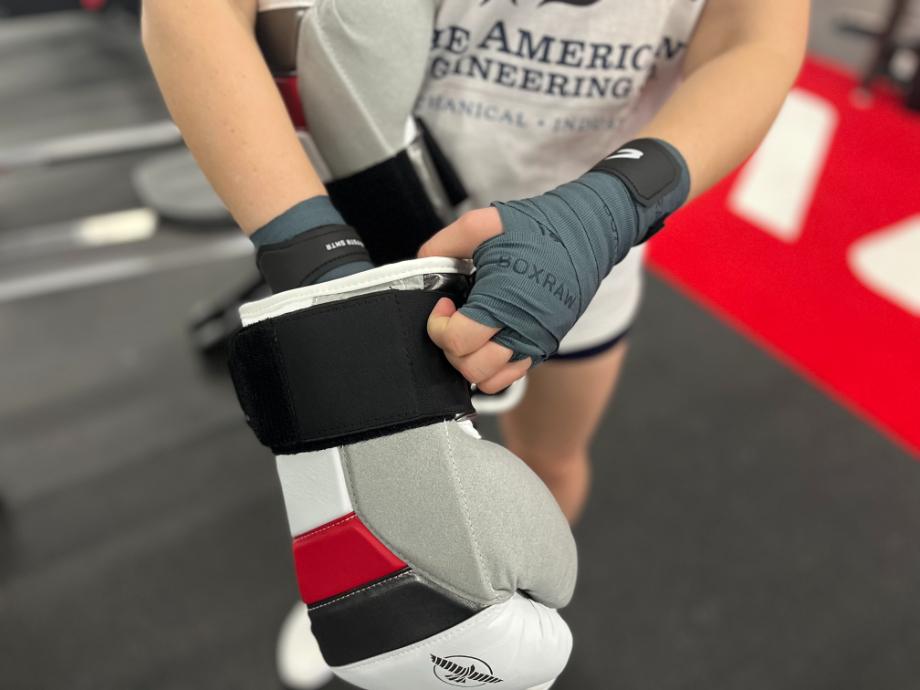 BOXRAW Hand Wraps shown in a boxing glove