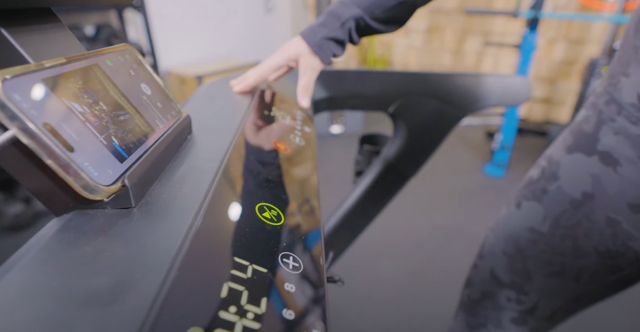 The controls and phone mount on a Centr RUNR-S treadmill.