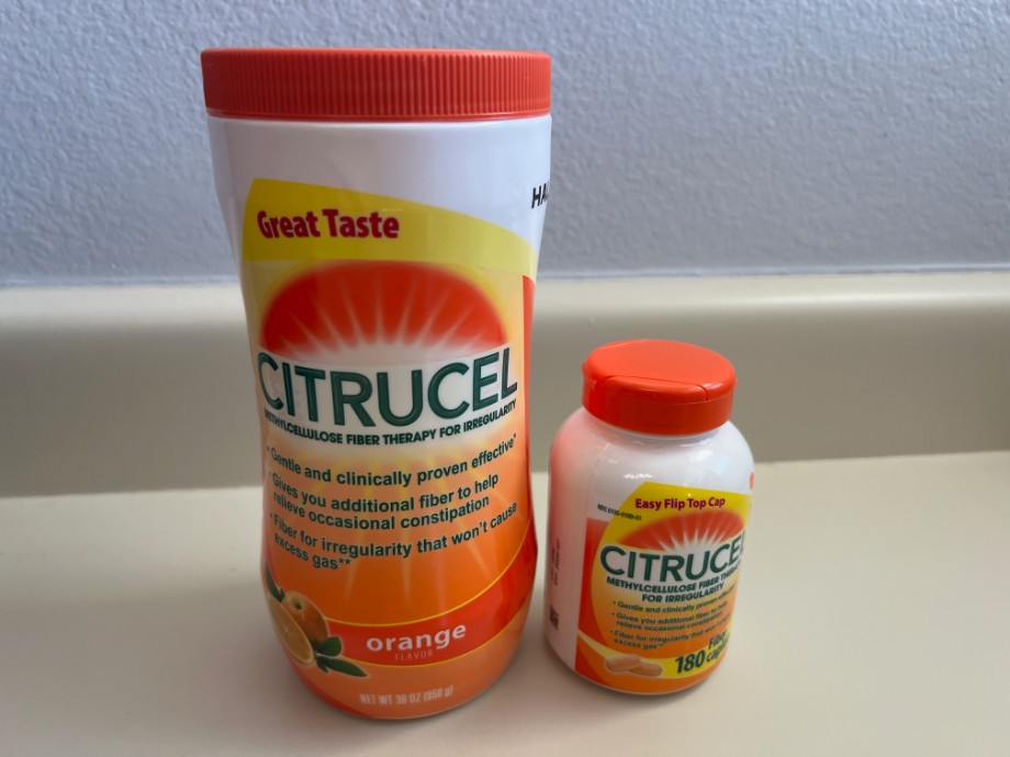 A container of Citrucel powder next to a bottle of Citrucel tablets