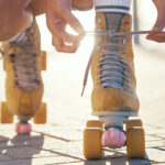 closeup-of-person-lacing-up-roller-skates