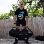 Coop using the GORUCK Sandbag during a workout