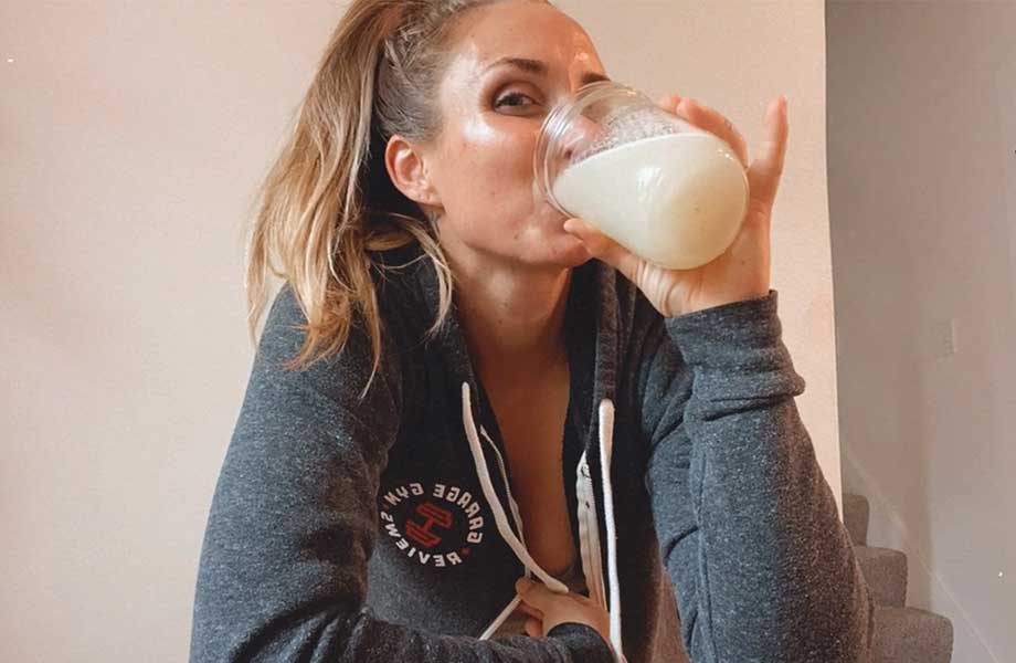 Woman drinking Ascent Pre-Workout