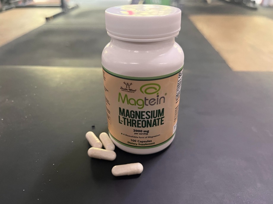 Bottle of Double Wood Magnesium with capsules in front of it