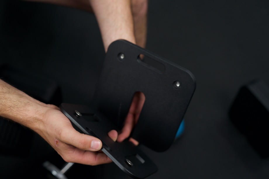 Close look as Coop adjusts the weight plates for an Eisenlink Adjustable Dumbbell.