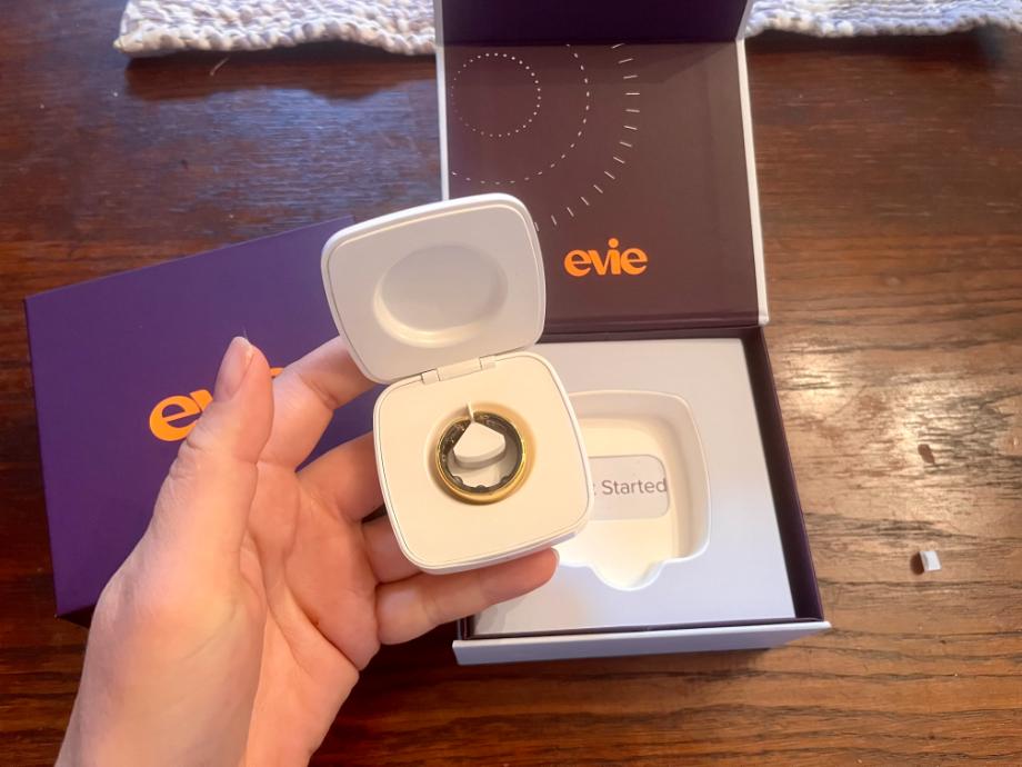 Lifting an Evie Ring from the box.