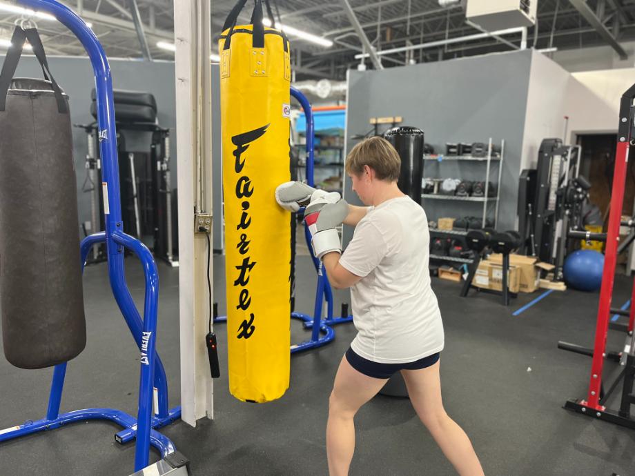 A full view of our tester punching the Fairtex Banana Bag