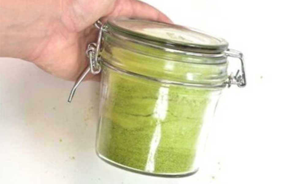 A jar of homemade green pea protein powder.