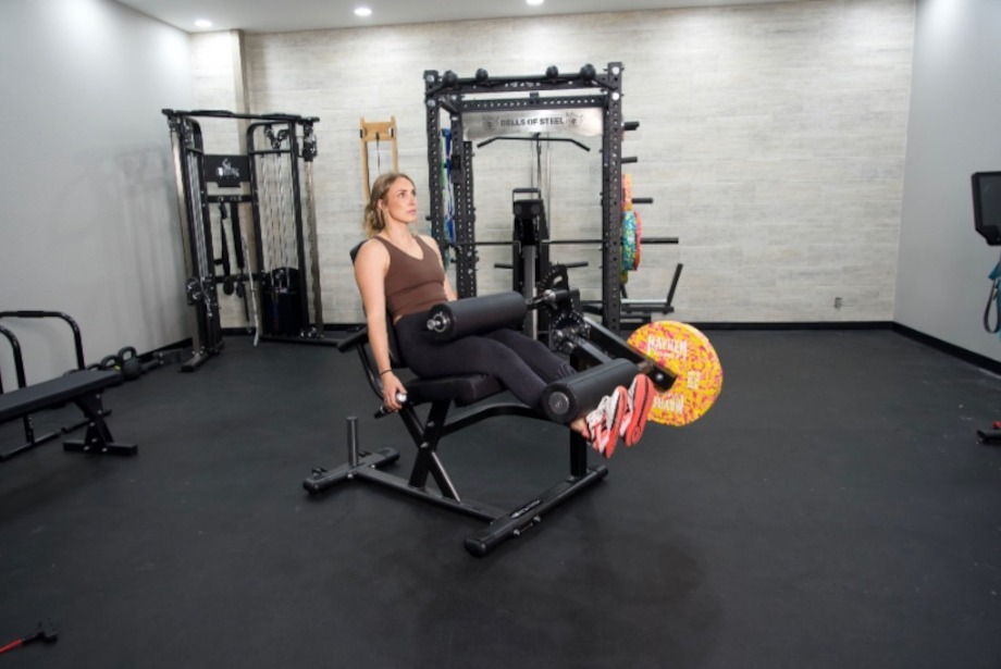 A side view of the Gronk Fitness Leg Machine while in use and fully extended.