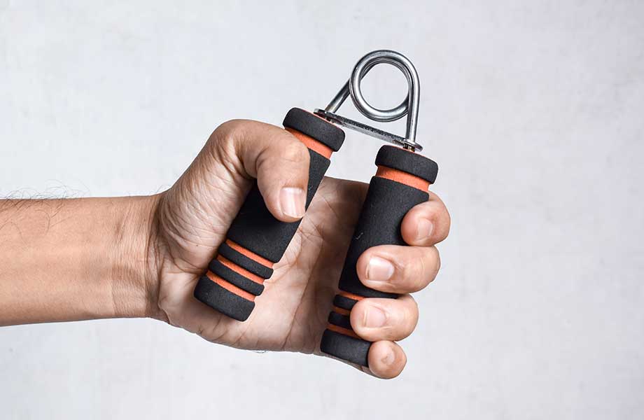 Hand holding grip strengthener