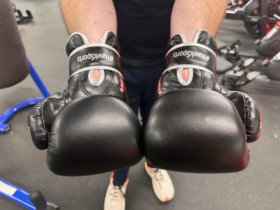 Hawk Sports Boxing Gloves on a person