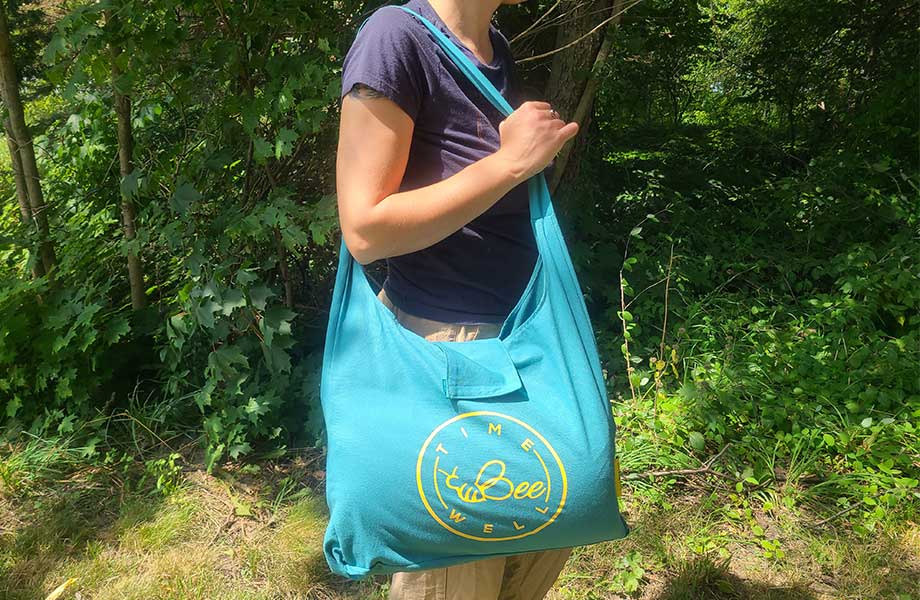 Holding the TimeBeeWell Acupressure Mat in it's carry bag.