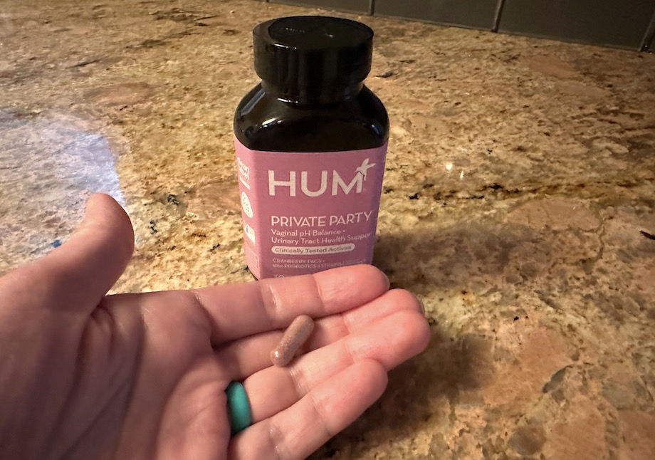 HUM Private Party Probiotic  capsule in hand.