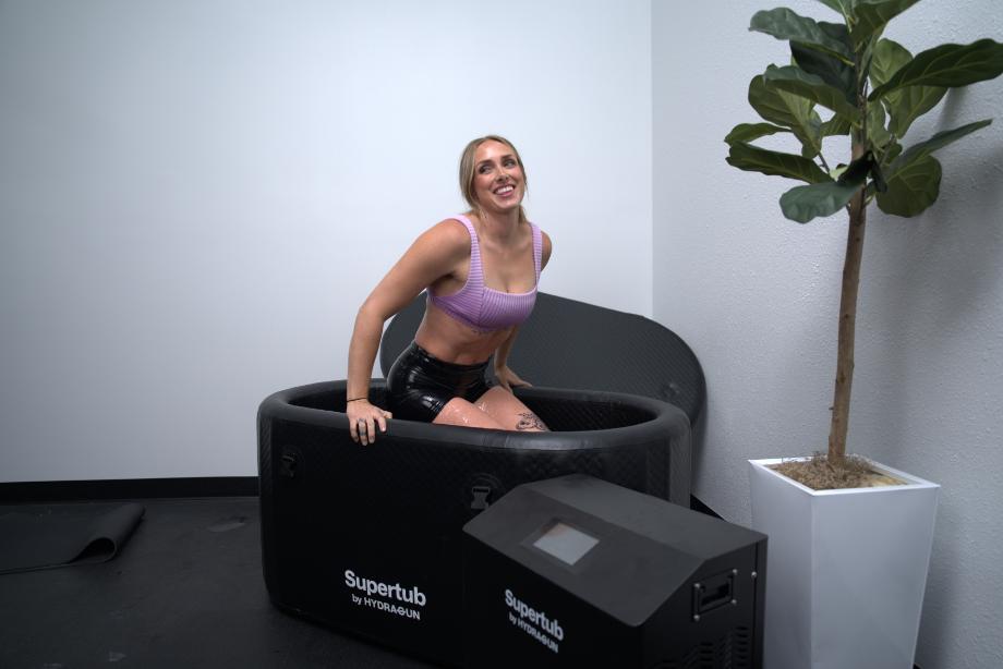 Linsday smiles while lifting herself out of the Hydragun Supertub Cold Plunge.