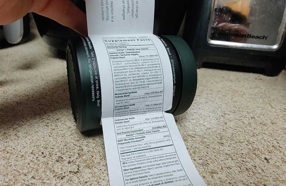 The Supplement Facts label is unfolded from the side of the bottle.