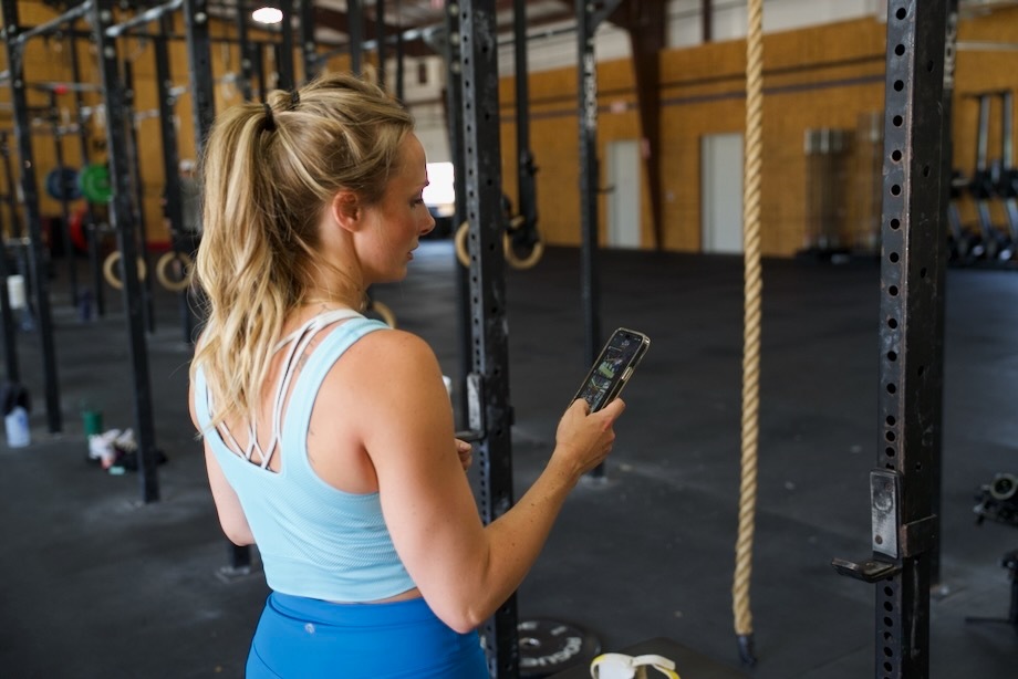 Lindsay uses the Legion Fitness App on her phone.