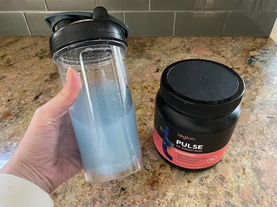 Holding a shaker cup of Legion Pulse