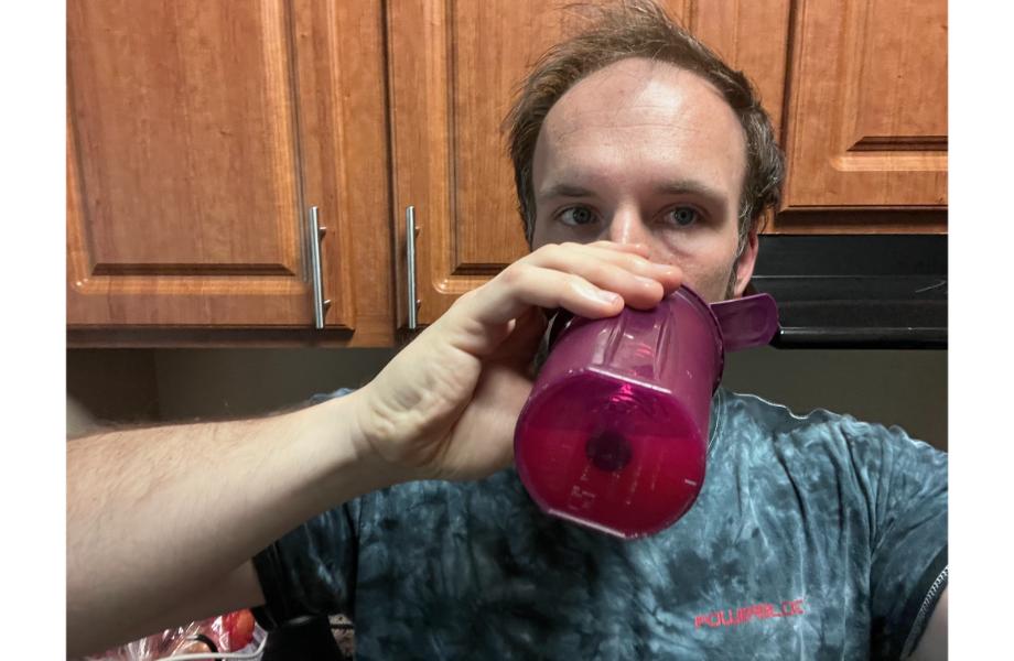 Man drinking EHP Labs Pride Pre-workout