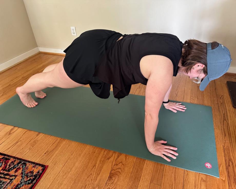 A person holds a plank on the Manduka PRO Yoga Mat.