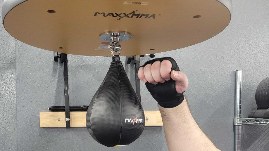 Our tester punching the MaxxMMA Speed Bag