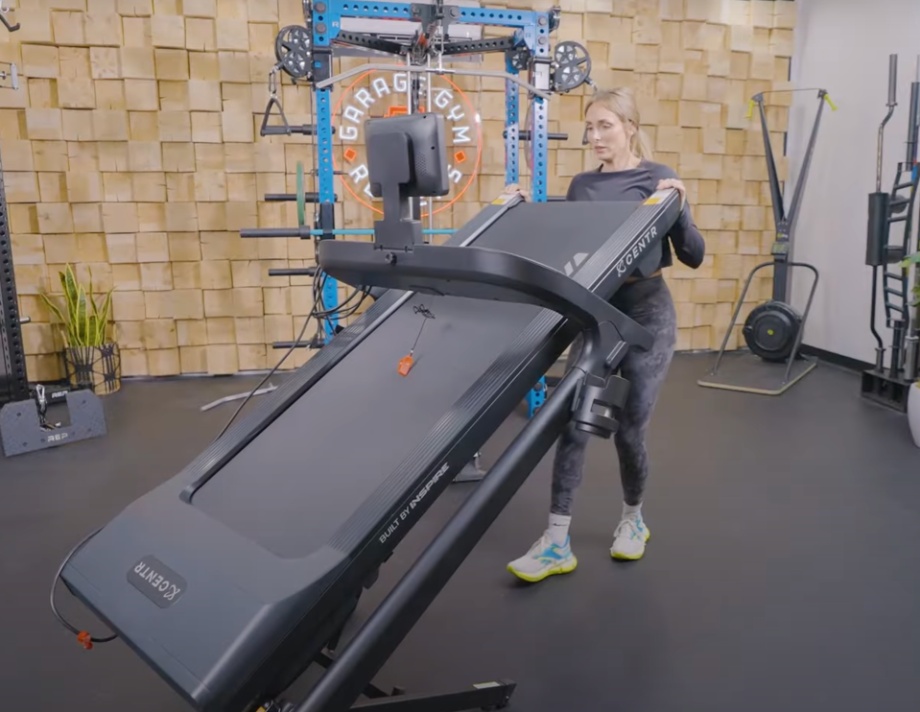 Lindsay Scheele moves the Centr RUNR-S Treadmill.