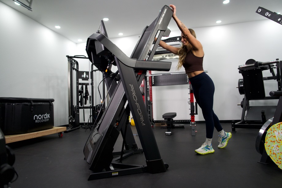 Lindsay Scheele, CPT, moving the ProForm Carbon Pro 2000 treadmill