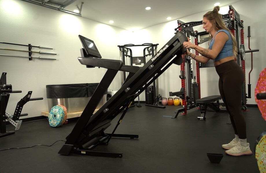 Our tester utilizing the foldable deck feature of the NordicTrack T Series 10 Treadmill