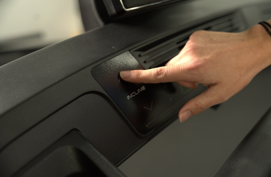 Our tester adjusting their workout settings on the NordicTrack T Series 10 Treadmill