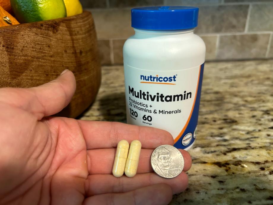 showing size of nutricost multivitamin in hand
