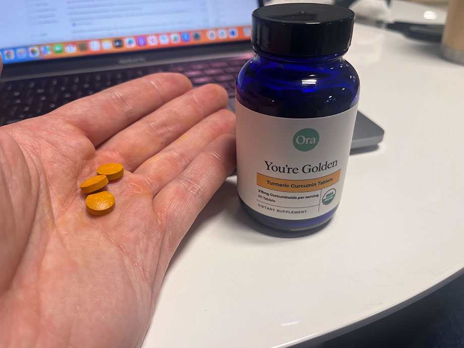 ora-organic-youre-golden-tablets-in-hand