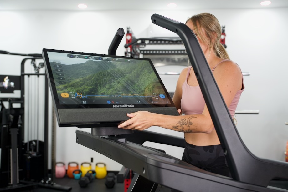 Person tilting screen on NordicTrack x24 Treadmill