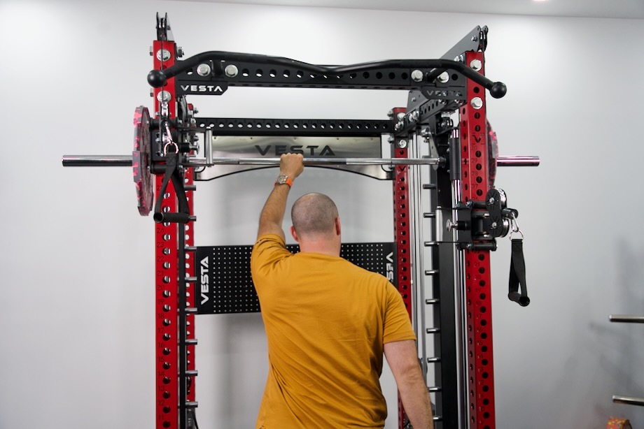 Coop stands with the Vesta Fitness Pro Series 3-in-1 Ultimate Rack with Smith Machine