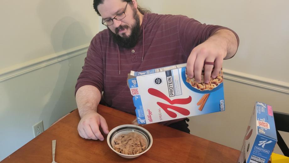 Olympian Caine Wilkes pours some Special K Protein Cereal into a bowl.