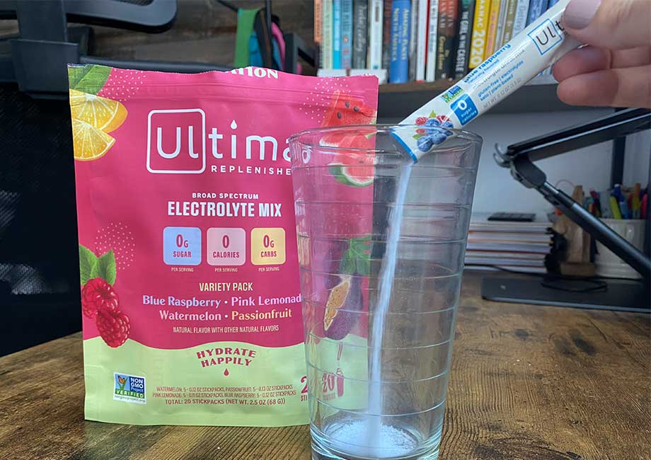 Our tester pours a packet of Ultima Replenisher into an empty glass