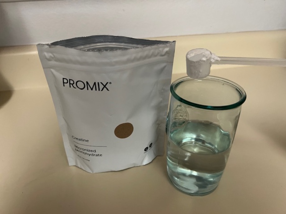 Promix Creatine and a glass of water