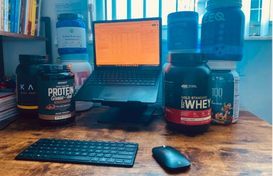 protein powders surrounding a computer