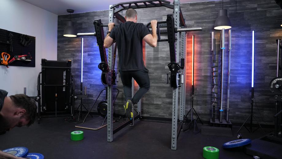 Coop does some pull-ups on a pair of PRx Halo Arms.